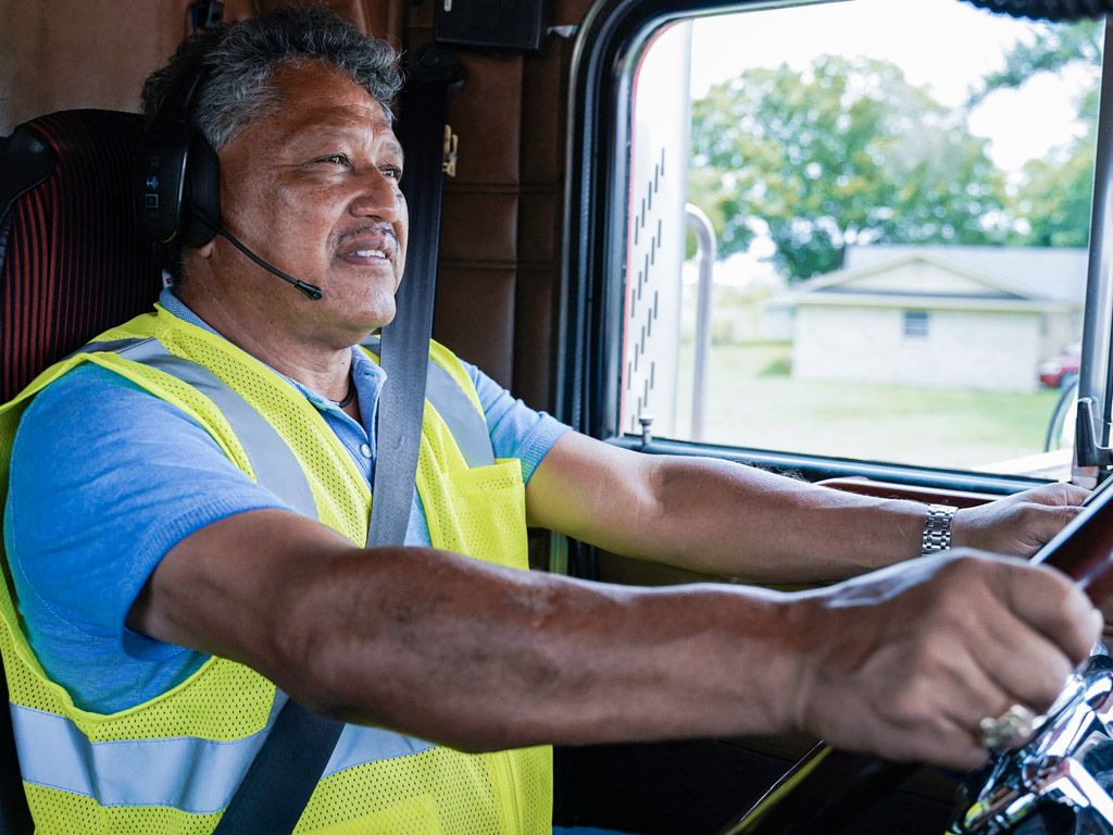 Male last mile delivery driver in truck